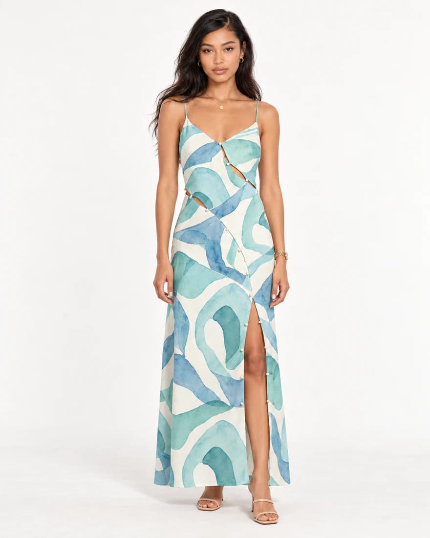 Model in a teal swirl print slip maxi dress with a thigh slit