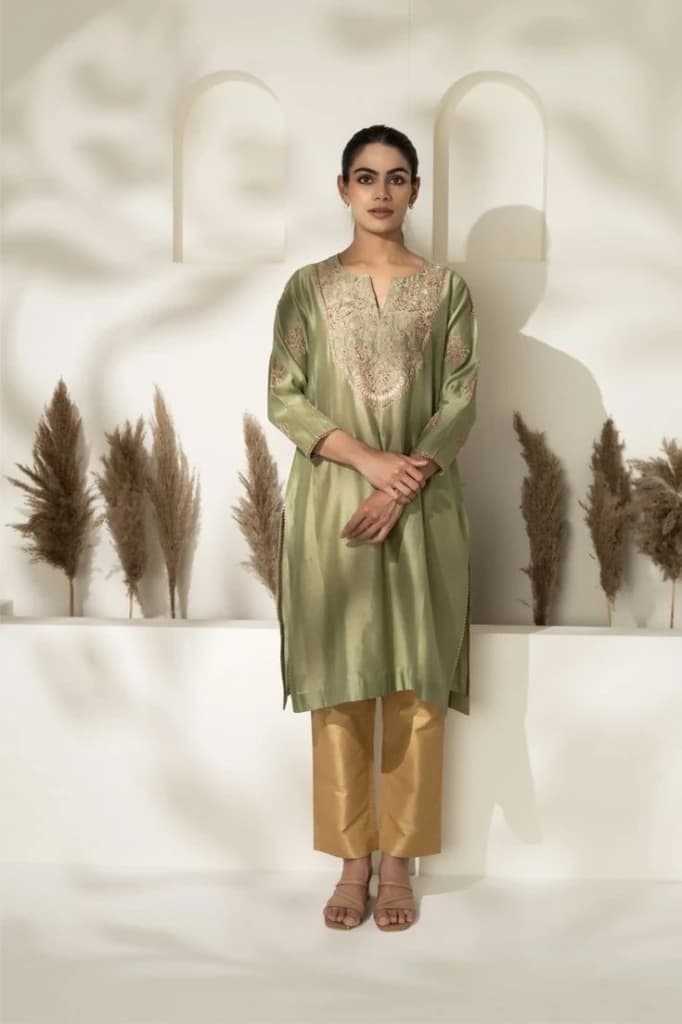 White studio with dried grass stalks