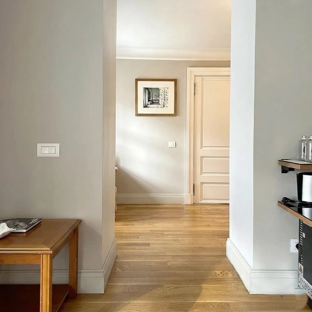 White doors with wooden plank floor