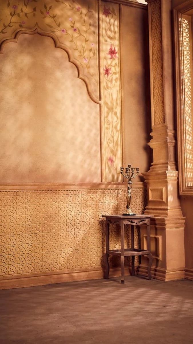 A grand, cinematic interior inspired by mughal and rajasthani architecture.