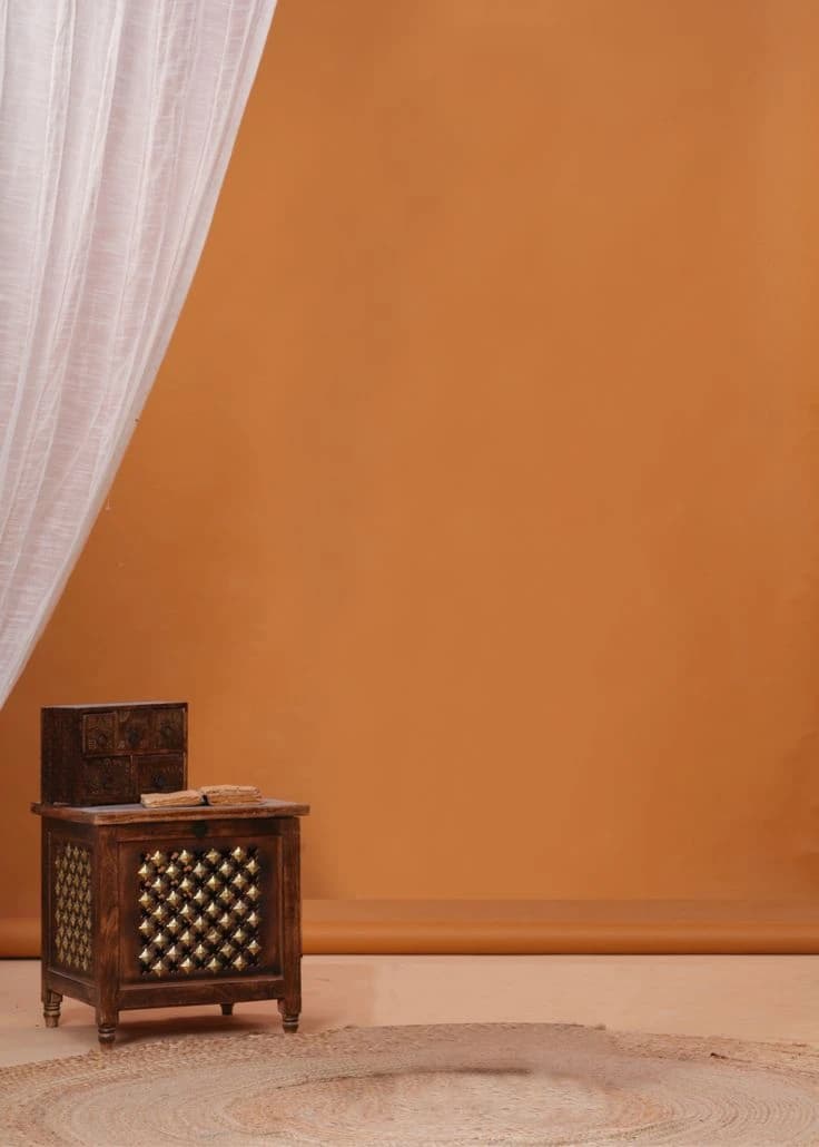 Warm minimal interior (terracotta wall + wooden cabinet)