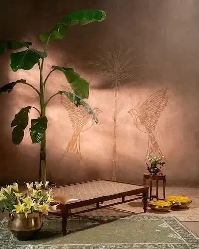Earthy-toned wall with a mottled has slender palm trees